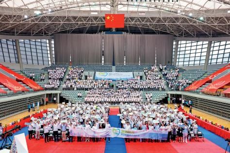 2019 年 7 月 9 日滬港兩地千名中學生齊聚復旦大學禮堂共同慶祝祖國七十華誕